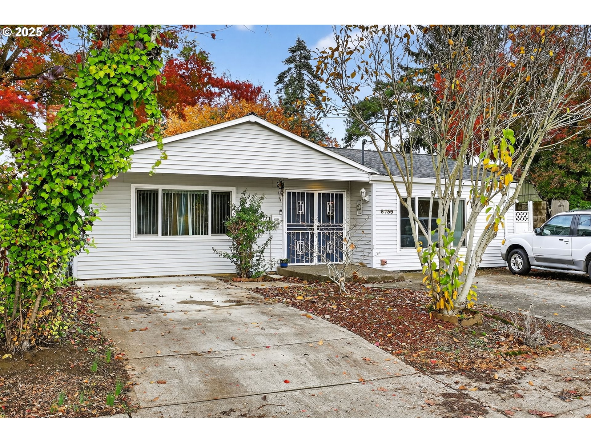 8739 Southeast Knapp Street Portland, OR 97266 - Photo 2 of 23 a view of a house with a outdoor space