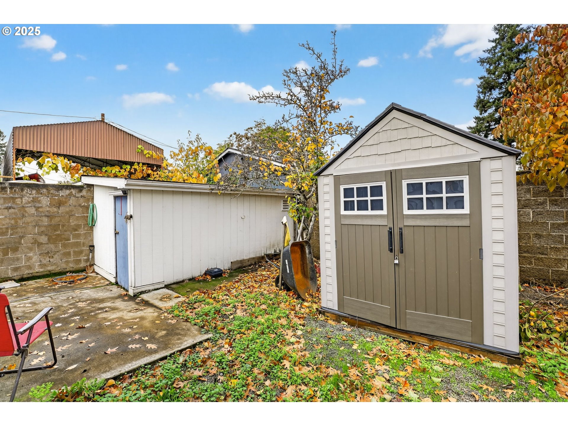 8739 Southeast Knapp Street Portland, OR 97266 - Photo 22 of 23 a view of a house with a yard