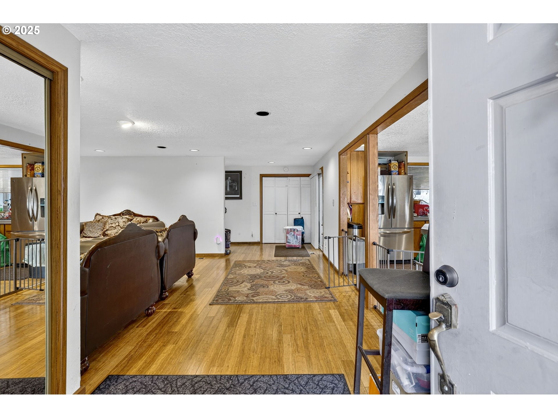 8739 Southeast Knapp Street Portland, OR 97266 - Photo 6 of 23 a living room with furniture and a flat screen tv