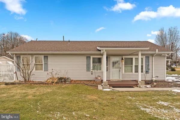 a front view of a house with yard