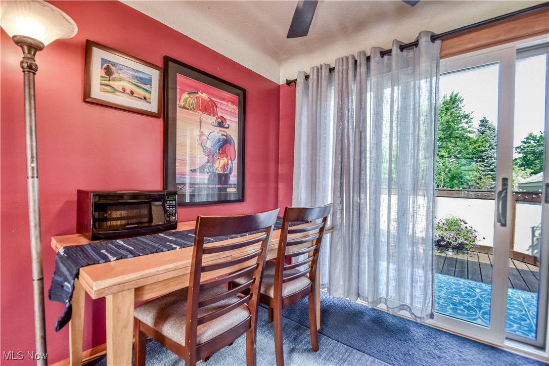 Dining space featuring carpet and a ceiling fan