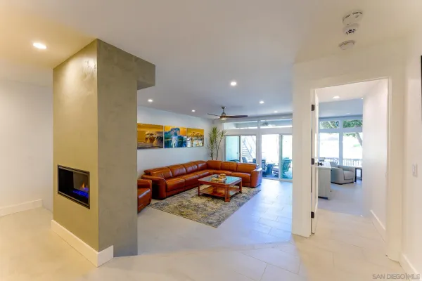 a kitchen with a sink a counter top space and stainless steel appliances