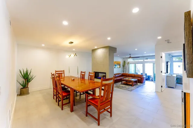 a dining area with a table and chairs