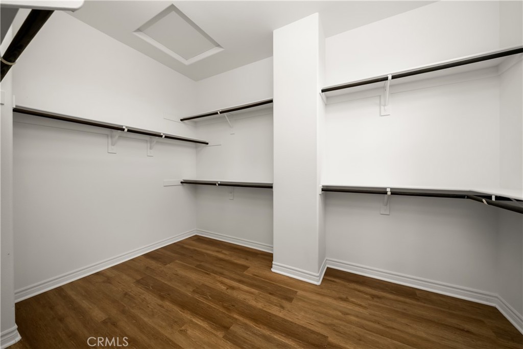 5212 Crimson Place Rancho Cucamonga, CA 91739 - Photo 39 of 62 a view of an empty room with wooden floor and a window