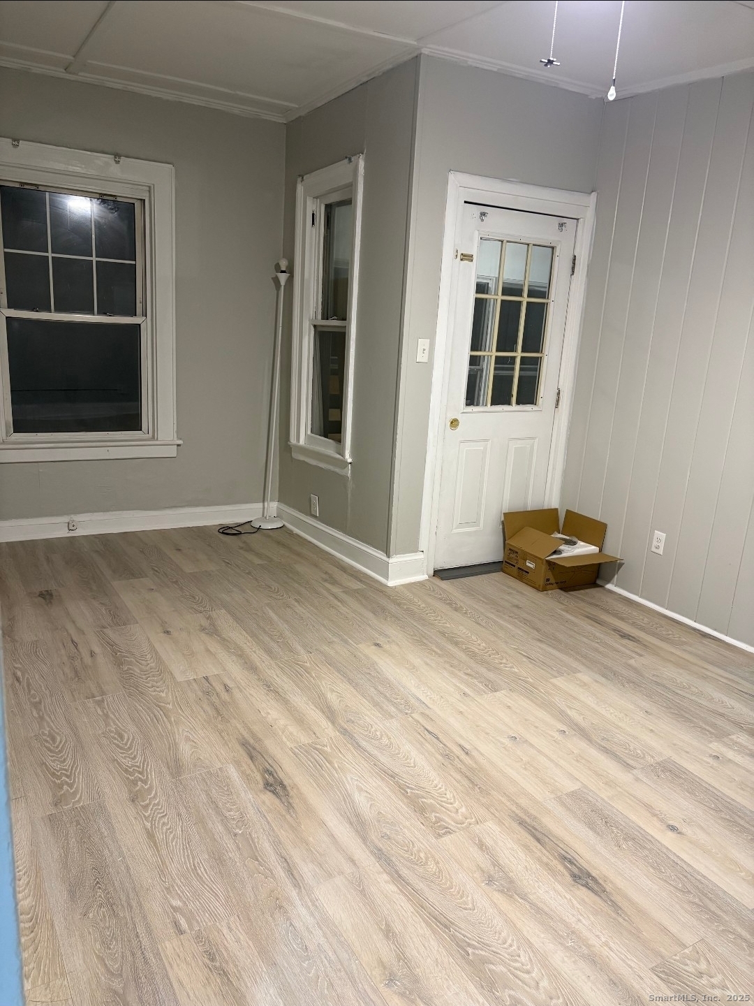 190 Howard Avenue, Unit 1 Ansonia, CT 06401 - Photo 2 of 7 a view of a livingroom with wooden floor and a cabinet