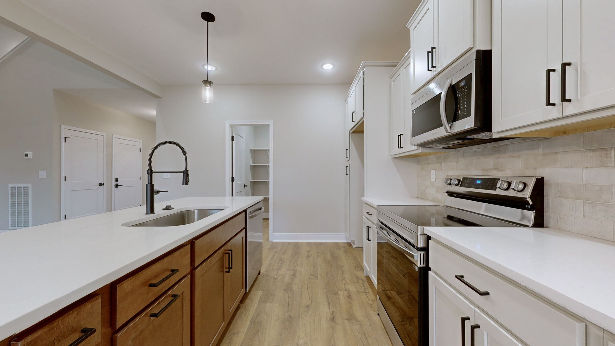 1417 Rooster Rdg Road Joelton, TN 37080 - Photo 3 of 37 a kitchen with stainless steel appliances granite countertop a sink and a microwave