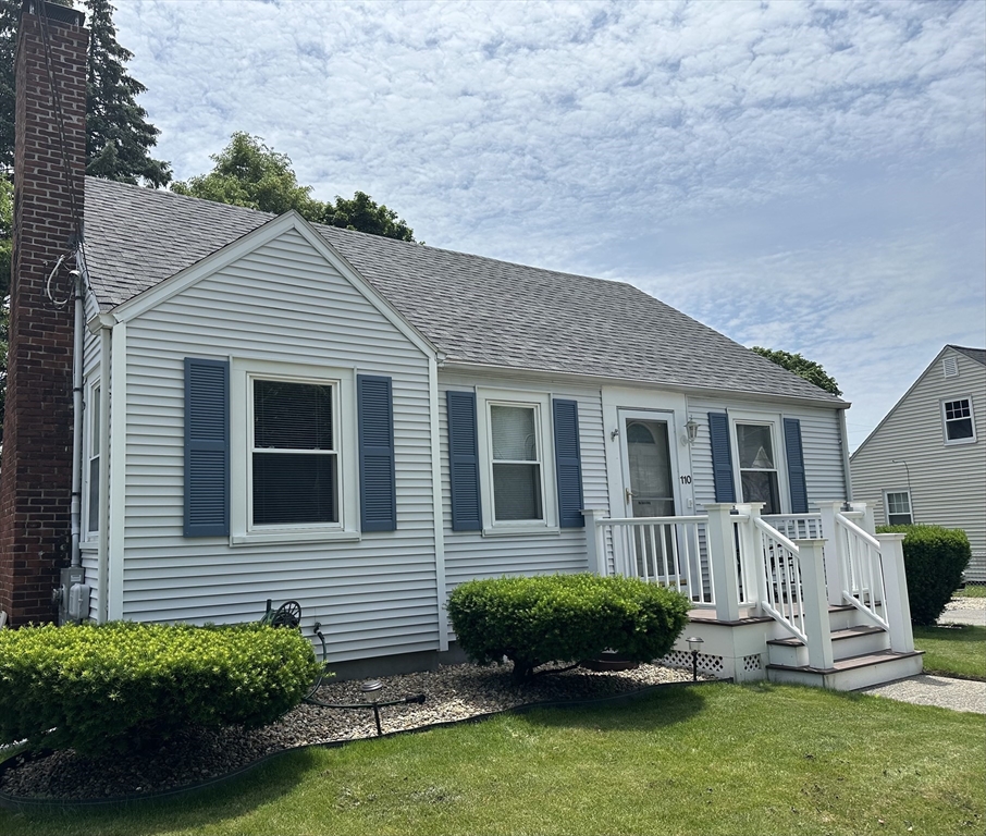 110 Holyoke Street Lynn, MA 01905 - Photo 1 of 13 a front view of a house with a yard