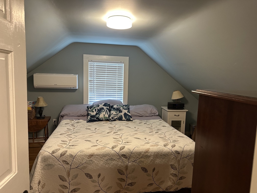 110 Holyoke Street Lynn, MA 01905 - Photo 11 of 13 a bedroom with a bed and a window