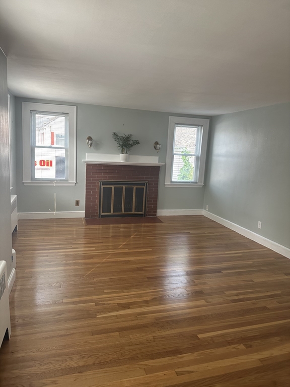 110 Holyoke Street Lynn, MA 01905 - Photo 3 of 13 a view of kitchen and hall with wooden floor