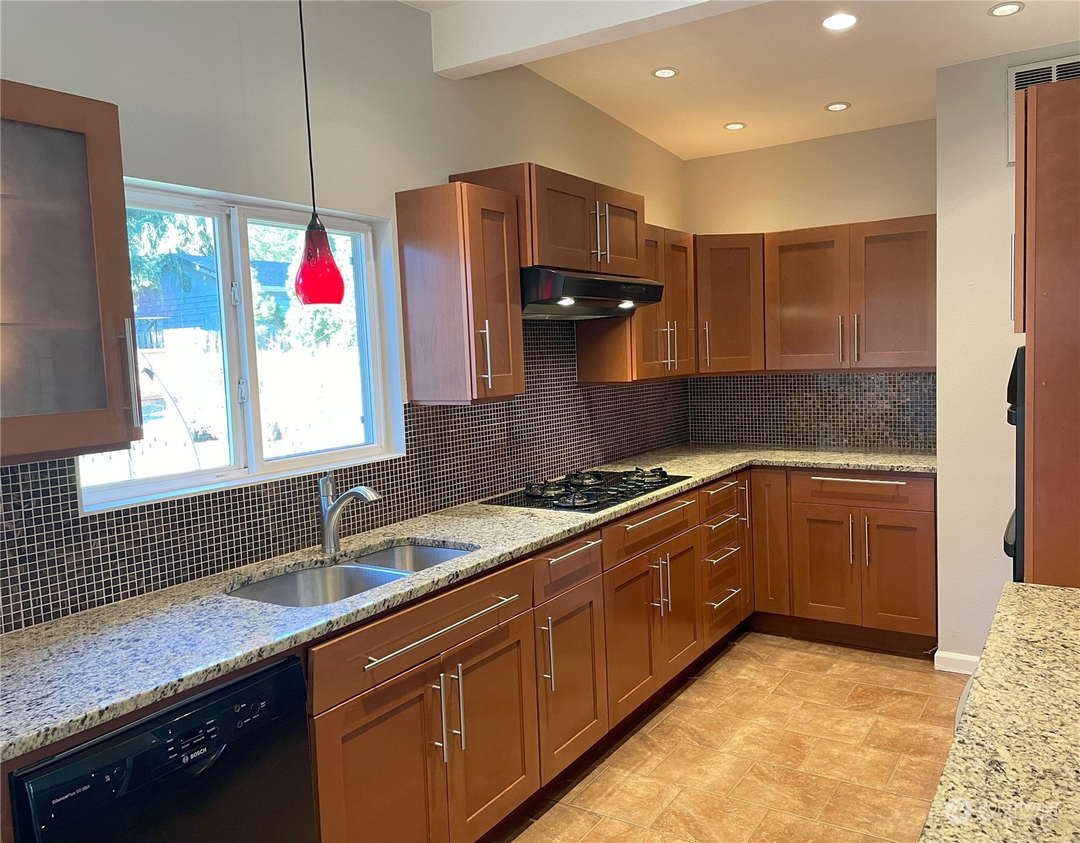 20043 96th Avenue Northeast Bothell, WA 98011 - Photo 3 of 13 a kitchen with granite countertop a sink stainless steel appliances and cabinets