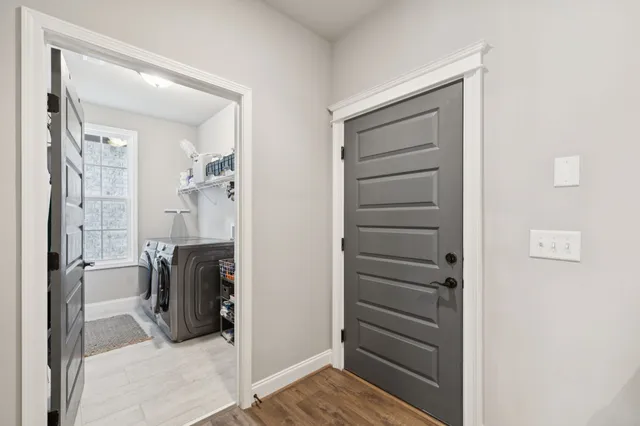 a view of walk in closet and bedroom