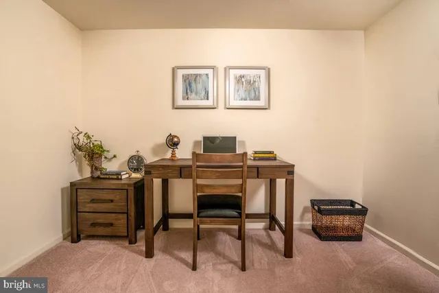 a view of a workspace with furniture