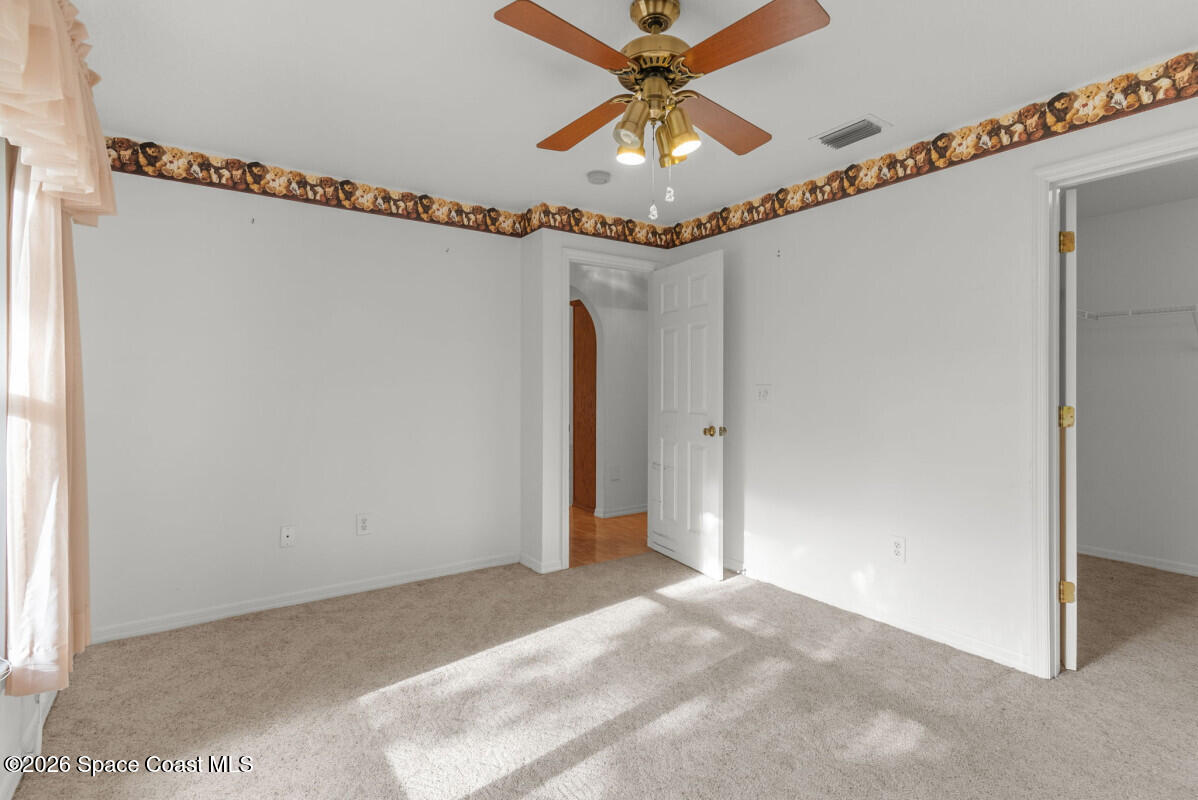 2493 Adamson Road Cocoa, FL 32926 - Photo 28 of 46 a view of a indoor ceiling fan