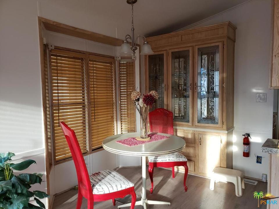 69801 Ramon Road, Unit 192 Cathedral City, CA 92234 - Photo 11 of 14 a dining room with furniture and window