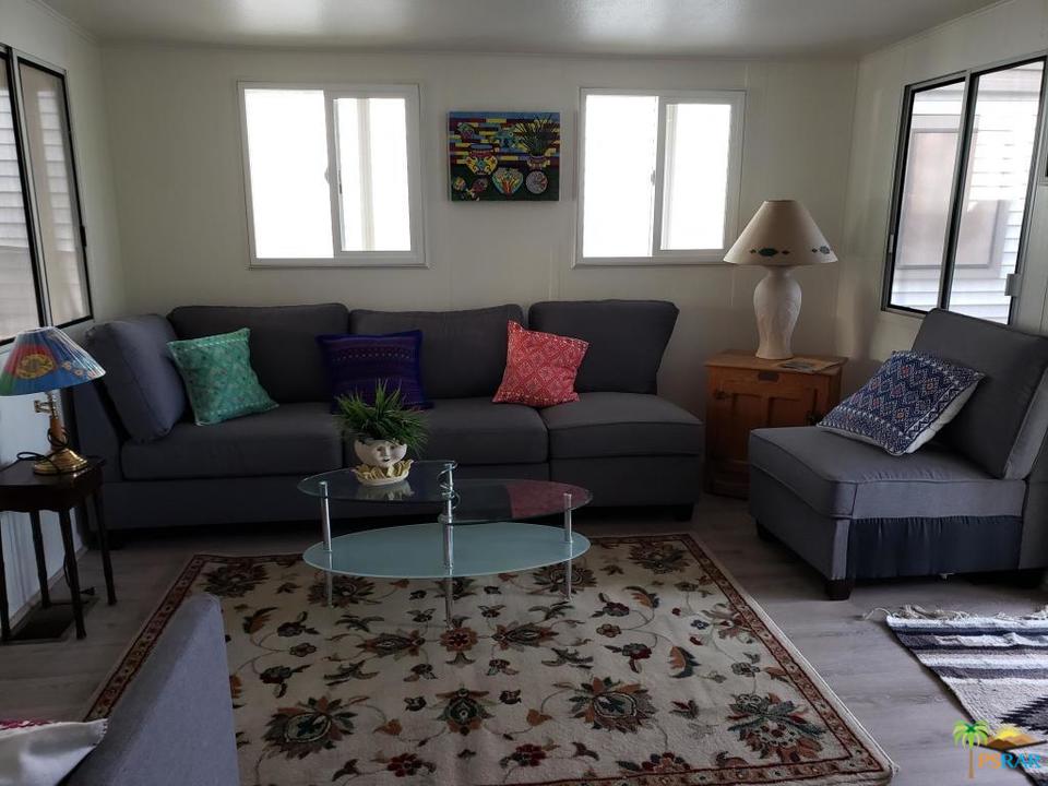 69801 Ramon Road, Unit 192 Cathedral City, CA 92234 - Photo 14 of 14 a living room with furniture and a rug