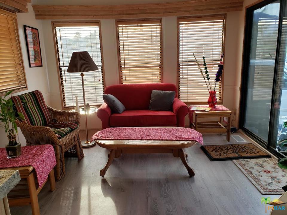 69801 Ramon Road, Unit 192 Cathedral City, CA 92234 - Photo 2 of 14 a living room with furniture and a window