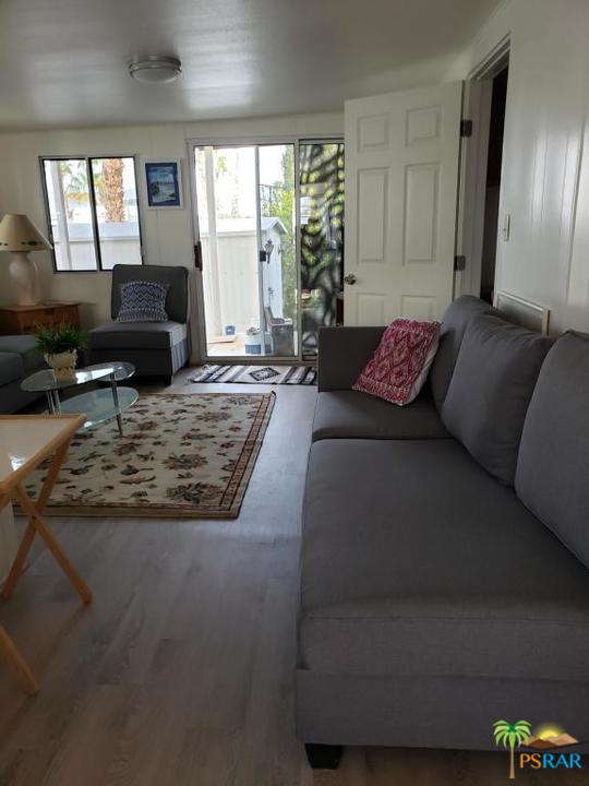 69801 Ramon Road, Unit 192 Cathedral City, CA 92234 - Photo 3 of 14 a living room with furniture and a large window