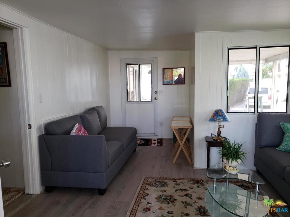 69801 Ramon Road, Unit 192 Cathedral City, CA 92234 - Photo 4 of 14 a living room with furniture a rug and a window