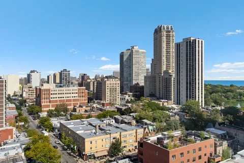 a view of city with tall buildings