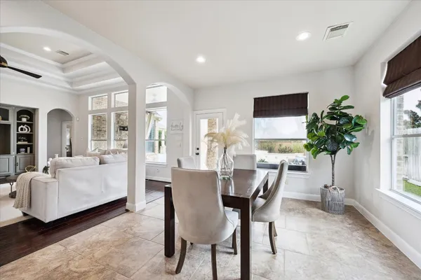 a view of a livingroom with furniture and a potted plant