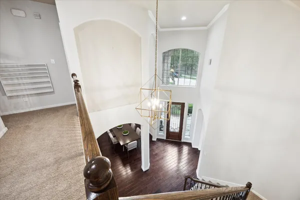 a view of a livingroom with furniture and staircase