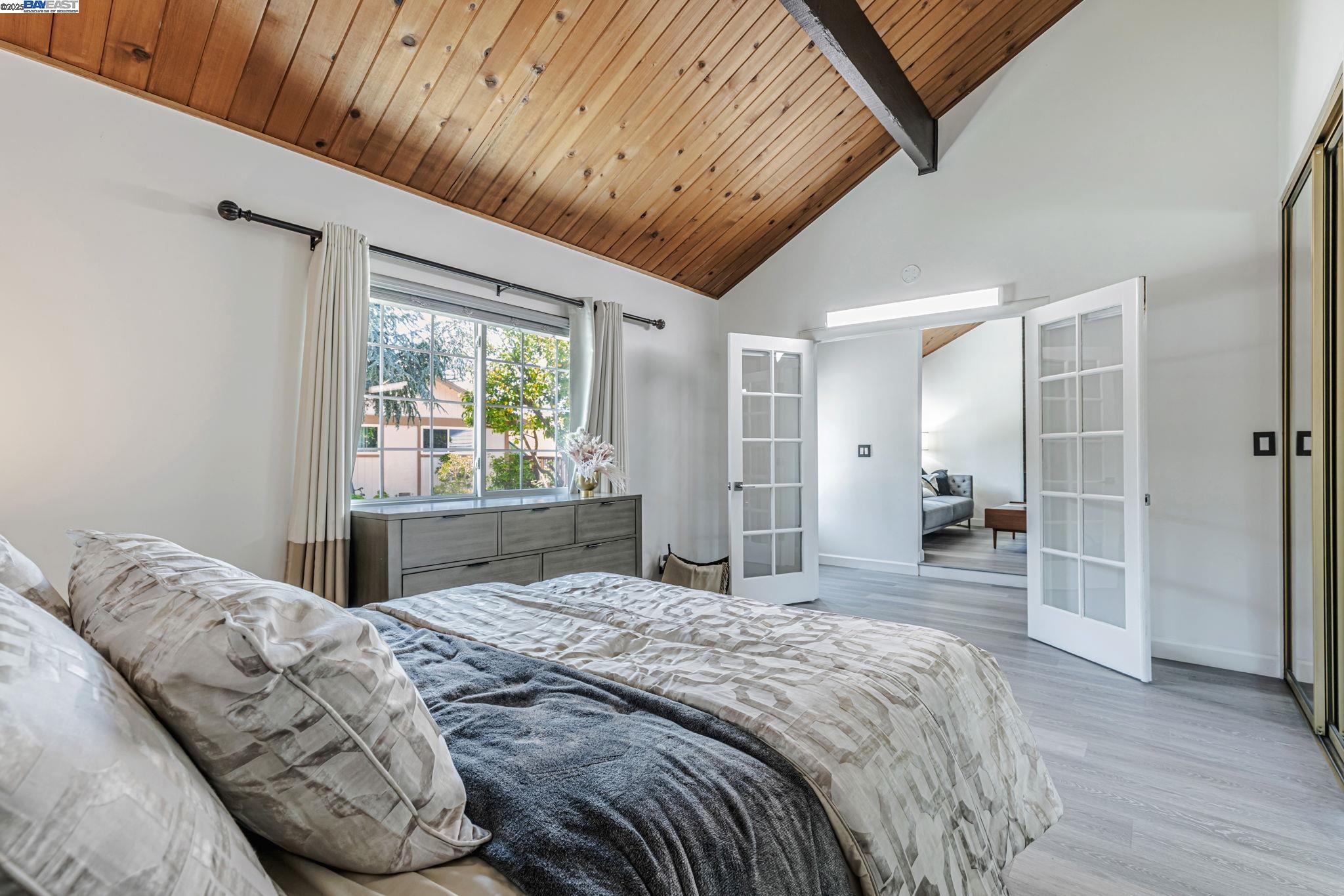 1835 Camino Estrada Concord, CA 94521 - Photo 12 of 27 a bedroom with a large bed and a large window