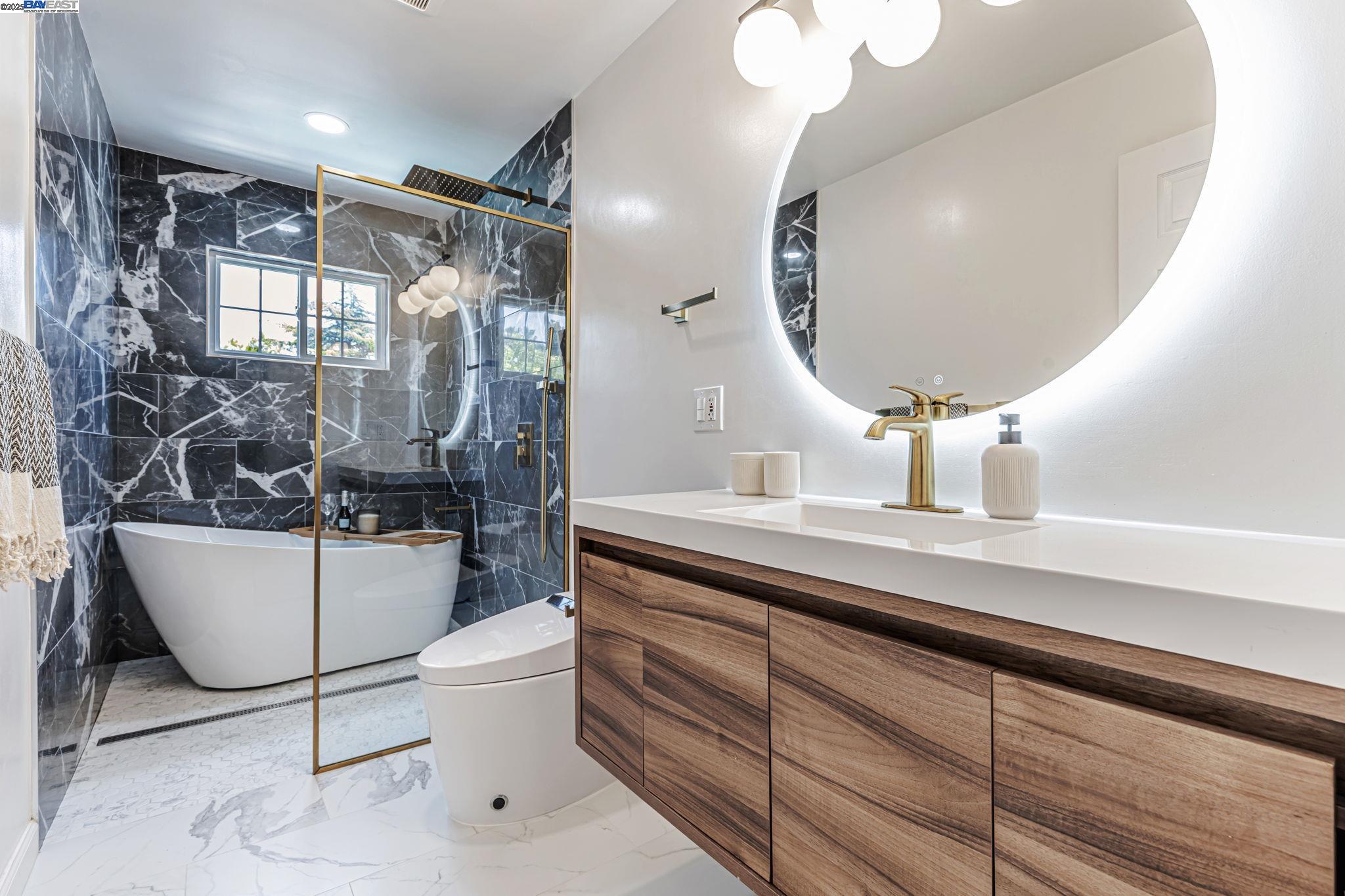1835 Camino Estrada Concord, CA 94521 - Photo 20 of 27 a bathroom with a toilet sink and mirror