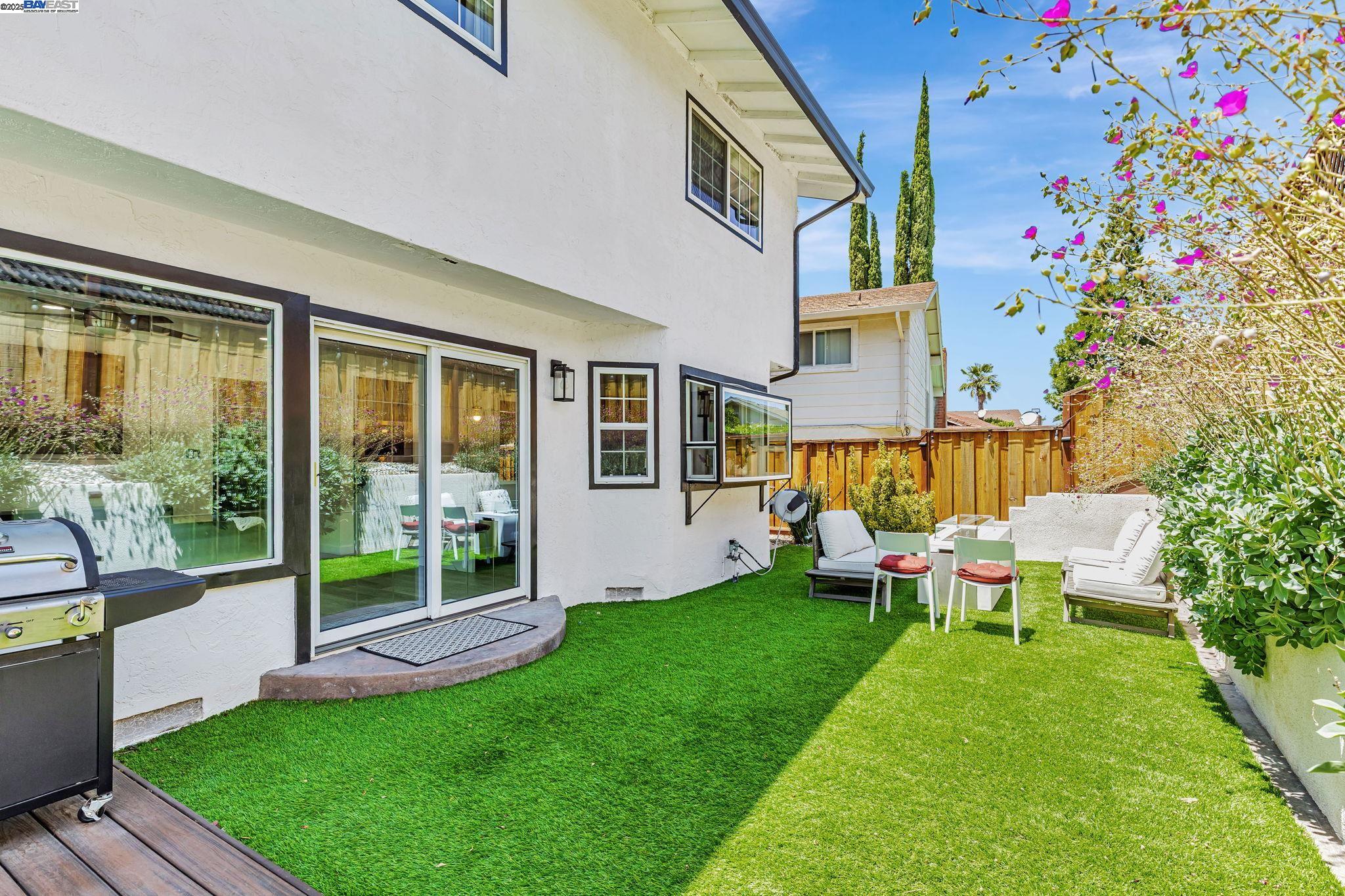 1835 Camino Estrada Concord, CA 94521 - Photo 22 of 27 a view of a house with backyard sitting area and garden