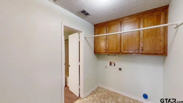 a bathroom with a window and a walk in closet