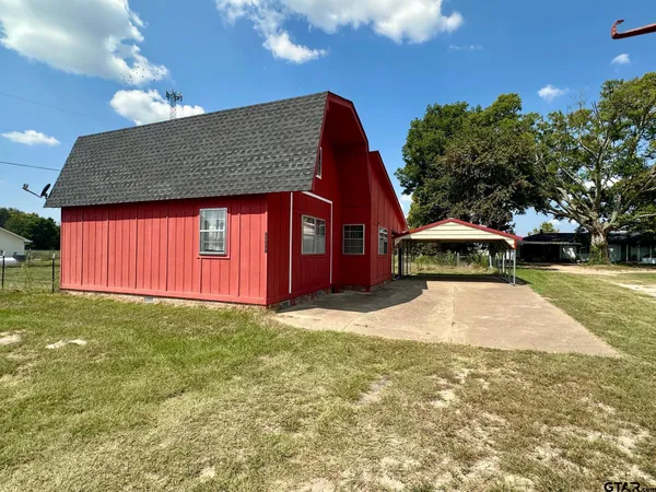 a front view of a house with yard