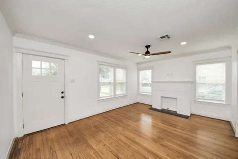 a kitchen with a stove a refrigerator and a window