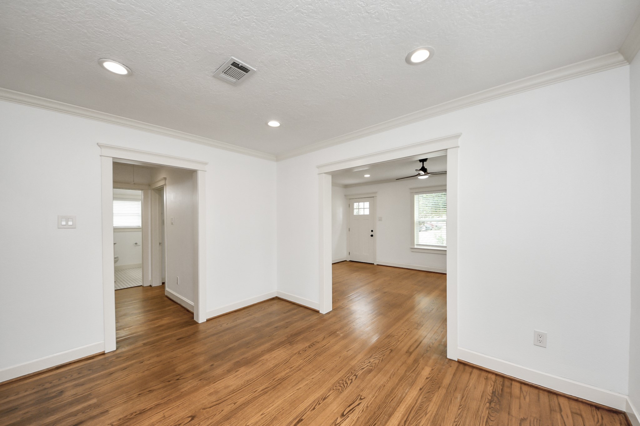 609 Reid Street Houston, TX 77022 - Photo 13 of 48 a view of empty room with wooden floor