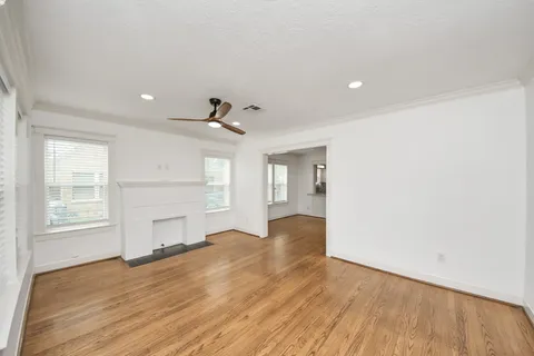 a view of a kitchen counter space a sink wooden floor and appliances