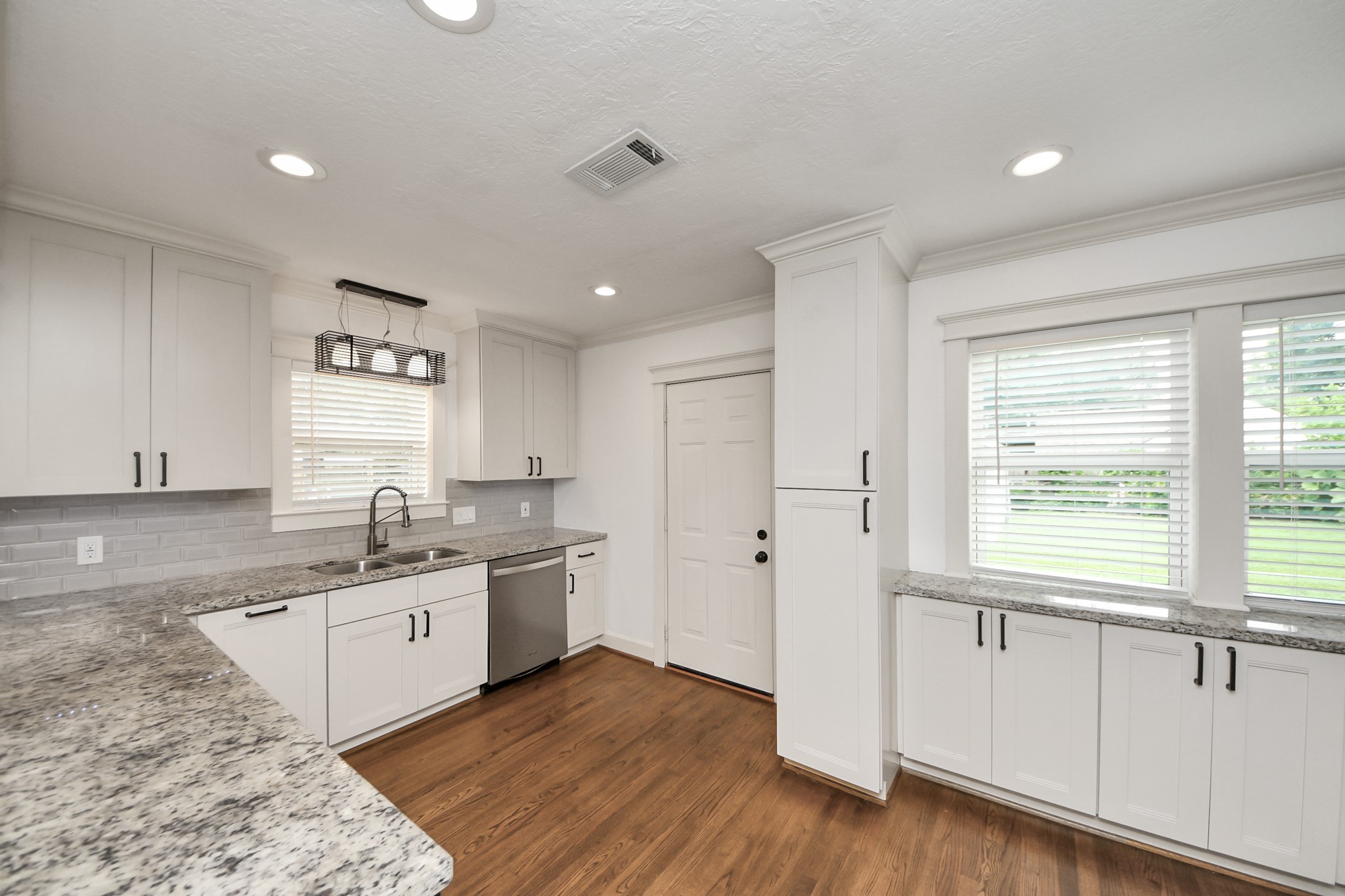 609 Reid Street Houston, TX 77022 - Photo 22 of 48 a kitchen with a sink appliances cabinets and a window