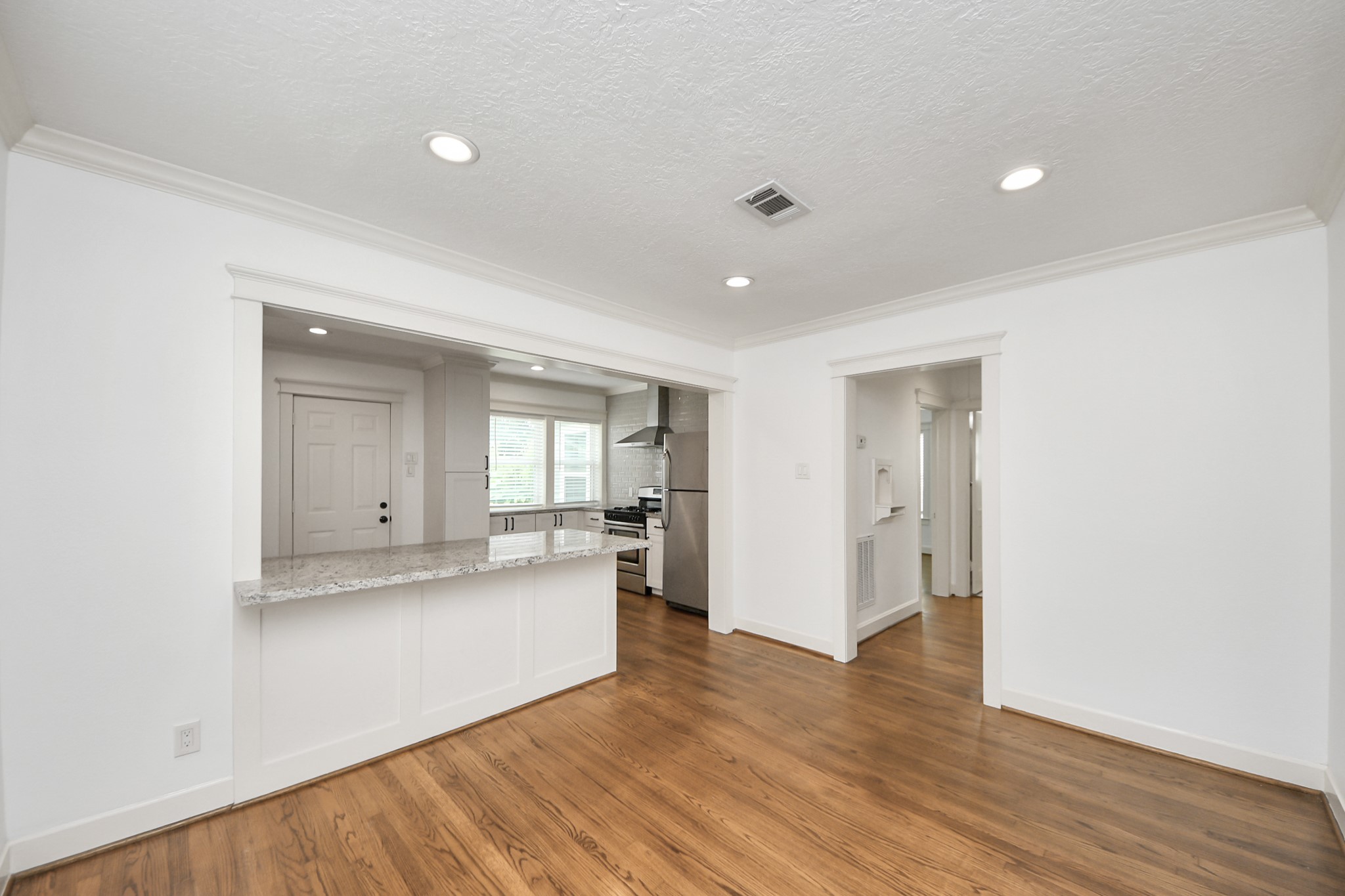 609 Reid Street Houston, TX 77022 - Photo 24 of 48 a view of a kitchen with a sink and a refrigerator