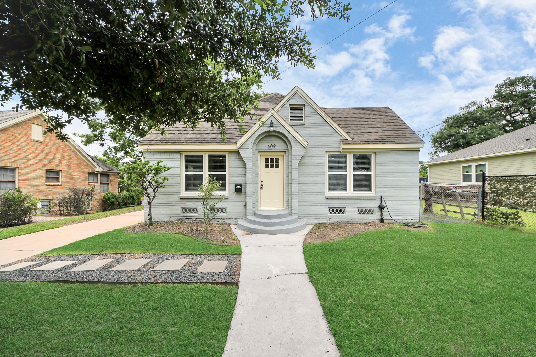 609 Reid Street Houston, TX 77022 - Photo 40 of 48 a front view of a house with a yard and trees