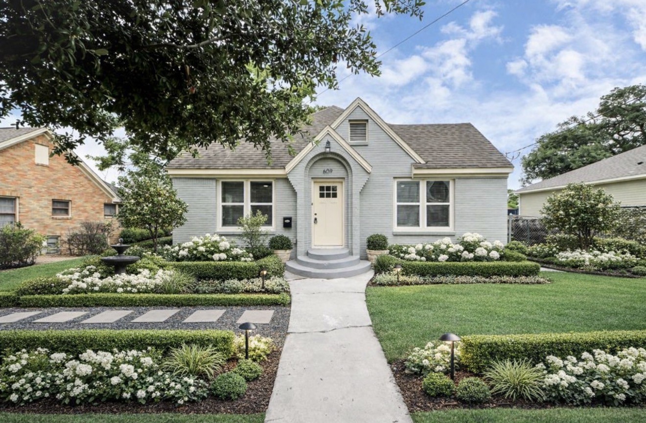 609 Reid Street Houston, TX 77022 - Photo 10 of 48 a front view of a house with a garden and plants