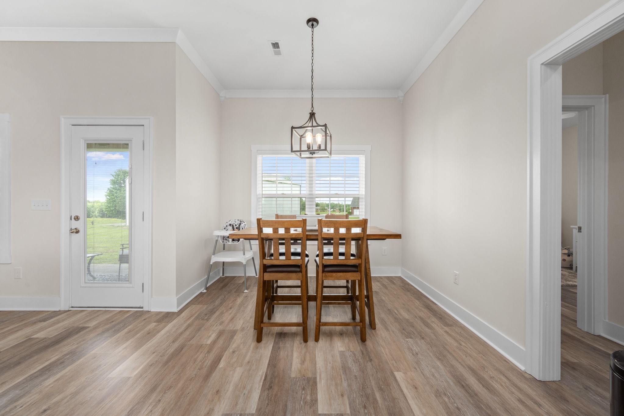 65 Joe Blanton Road Woodbury, TN 37190 - Photo 23 of 61 a dining room with furniture window and wooden floor