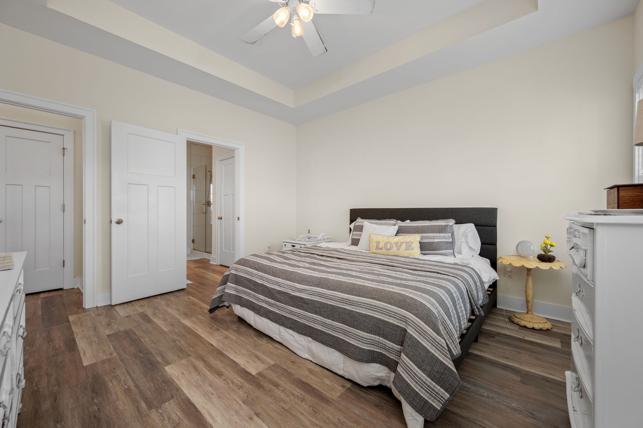 65 Joe Blanton Road Woodbury, TN 37190 - Photo 26 of 61 a bedroom with a bed and a chandelier