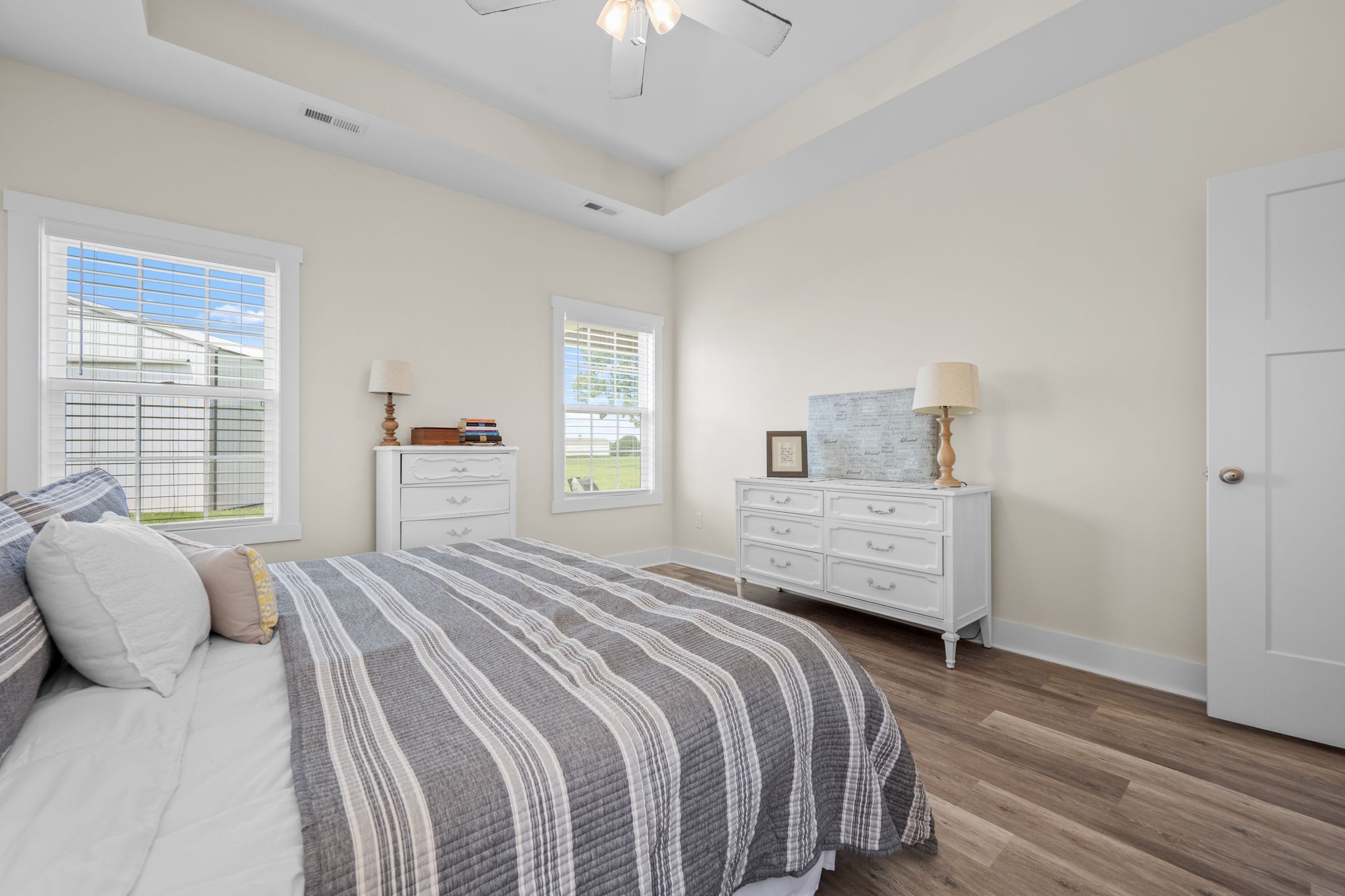 65 Joe Blanton Road Woodbury, TN 37190 - Photo 27 of 61 a bedroom with a bed and a chandelier