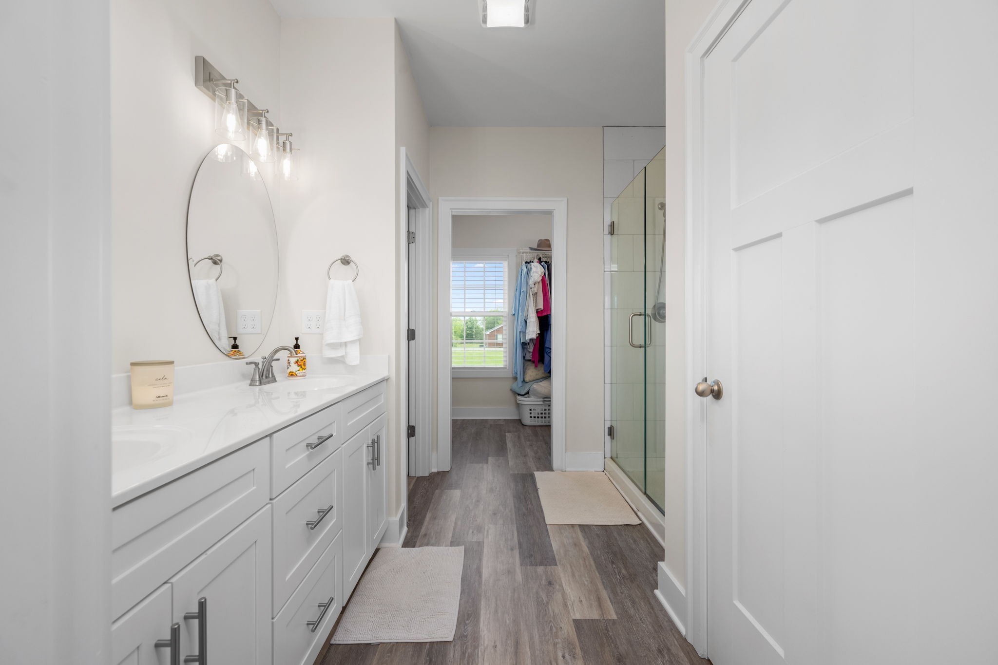 65 Joe Blanton Road Woodbury, TN 37190 - Photo 28 of 61 a bathroom with a double vanity sink and mirror with shower