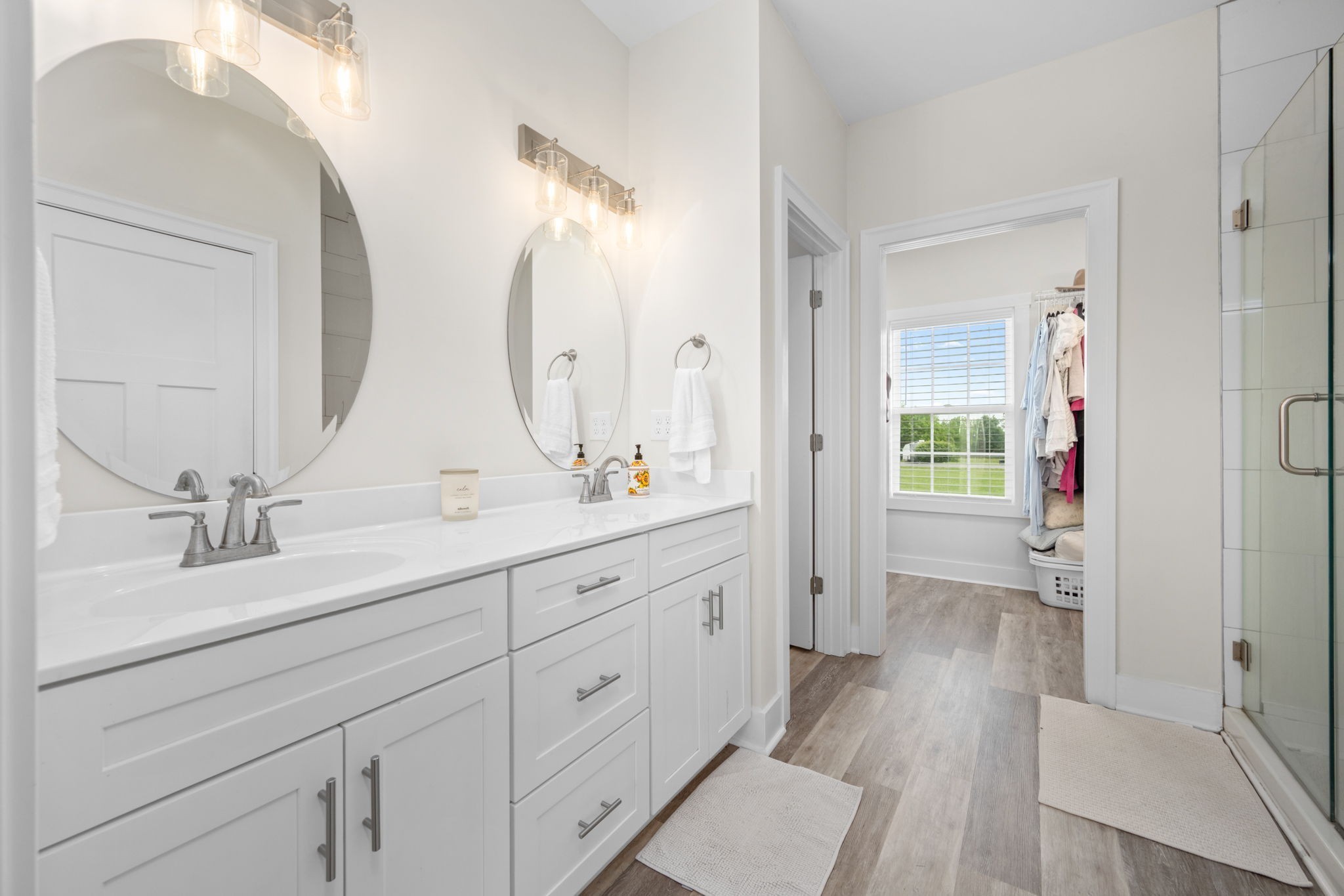 65 Joe Blanton Road Woodbury, TN 37190 - Photo 29 of 61 a bathroom with a double vanity sink and mirror with shower