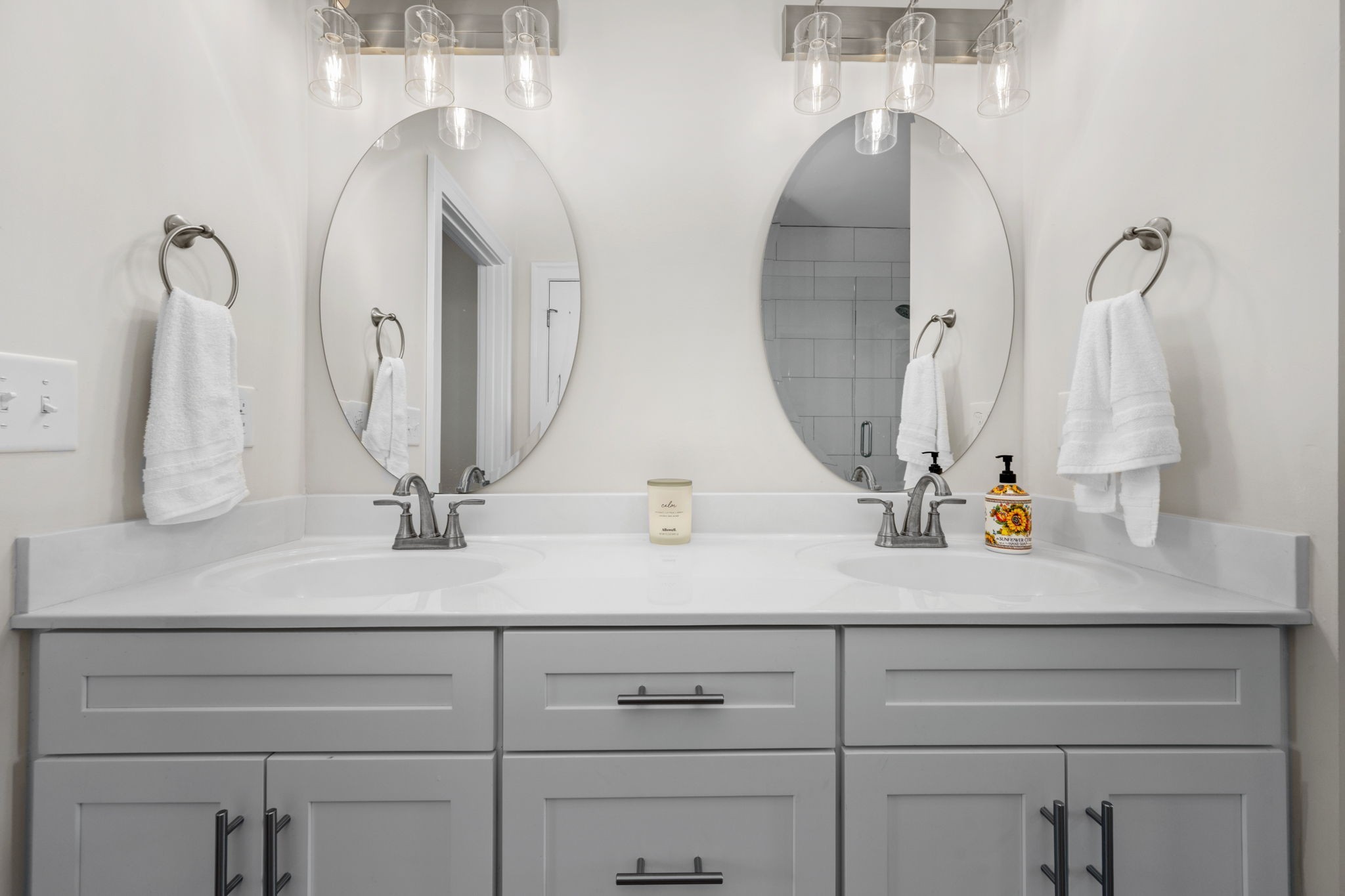 65 Joe Blanton Road Woodbury, TN 37190 - Photo 30 of 61 a bathroom with a double vanity sink and a mirror