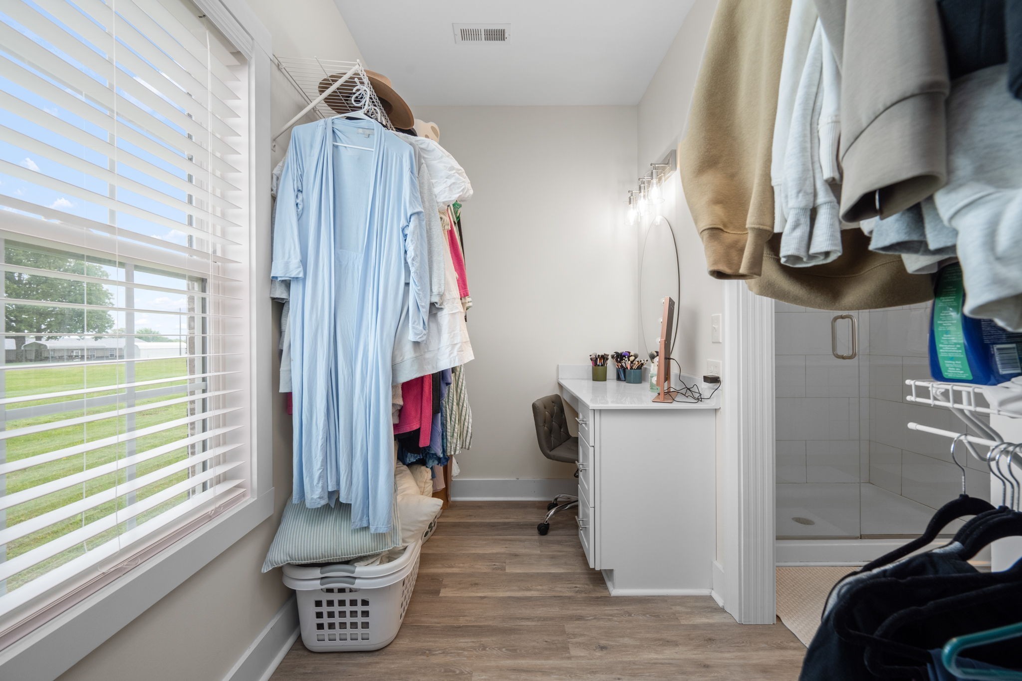 65 Joe Blanton Road Woodbury, TN 37190 - Photo 32 of 61 a view of walk in closet with clothes and shoes