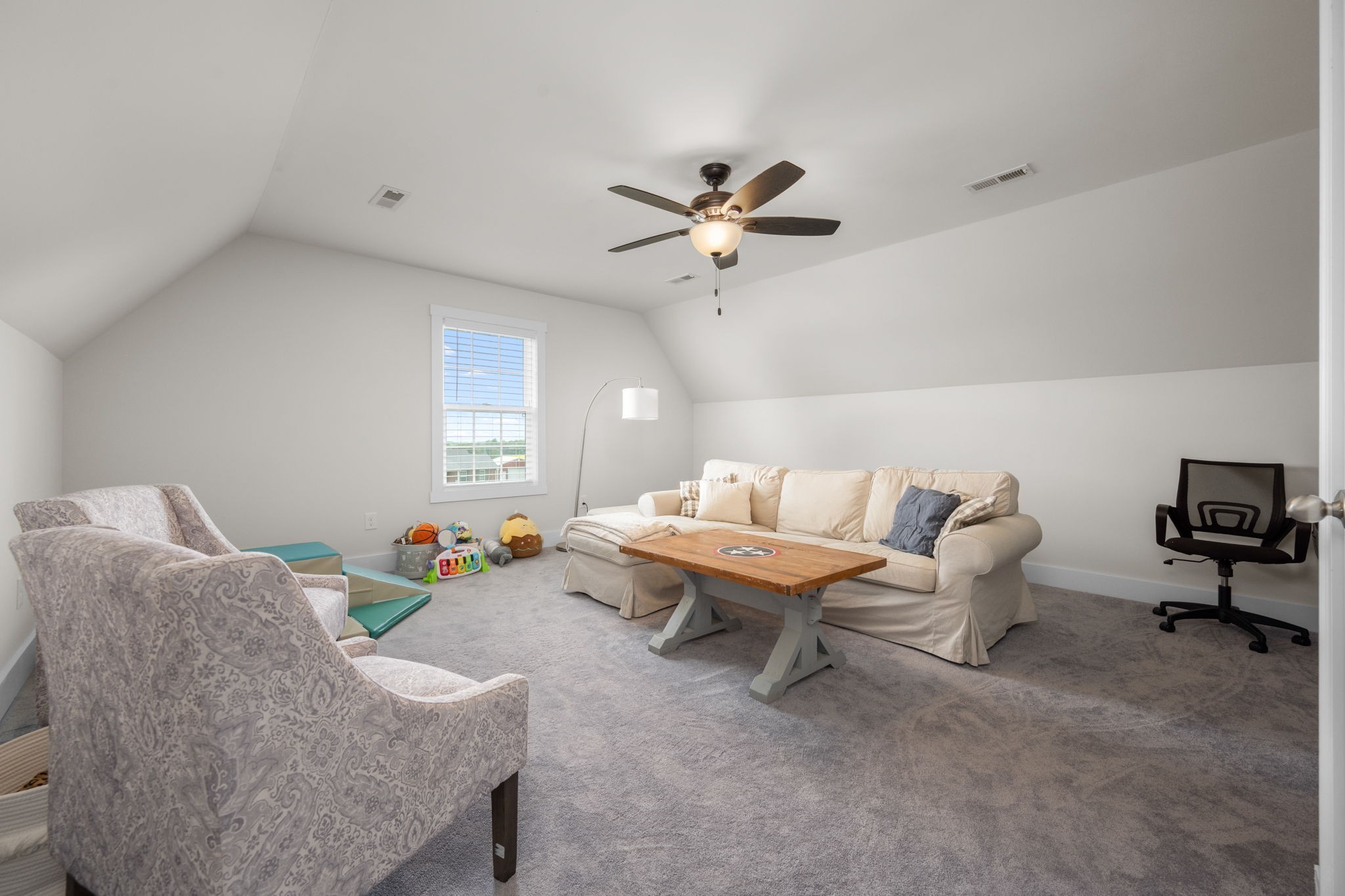 65 Joe Blanton Road Woodbury, TN 37190 - Photo 37 of 61 a living room with furniture and a ceiling fan