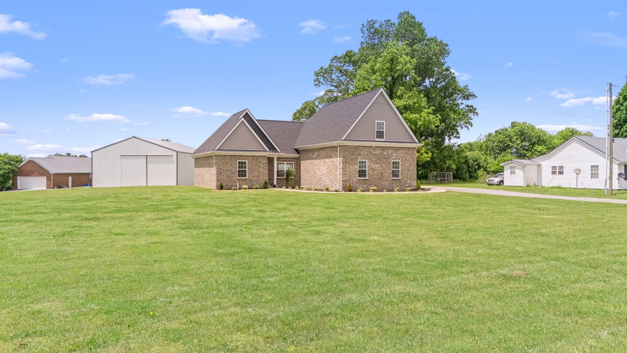 65 Joe Blanton Road Woodbury, TN 37190 - Photo 5 of 61 a front view of a house with a garden