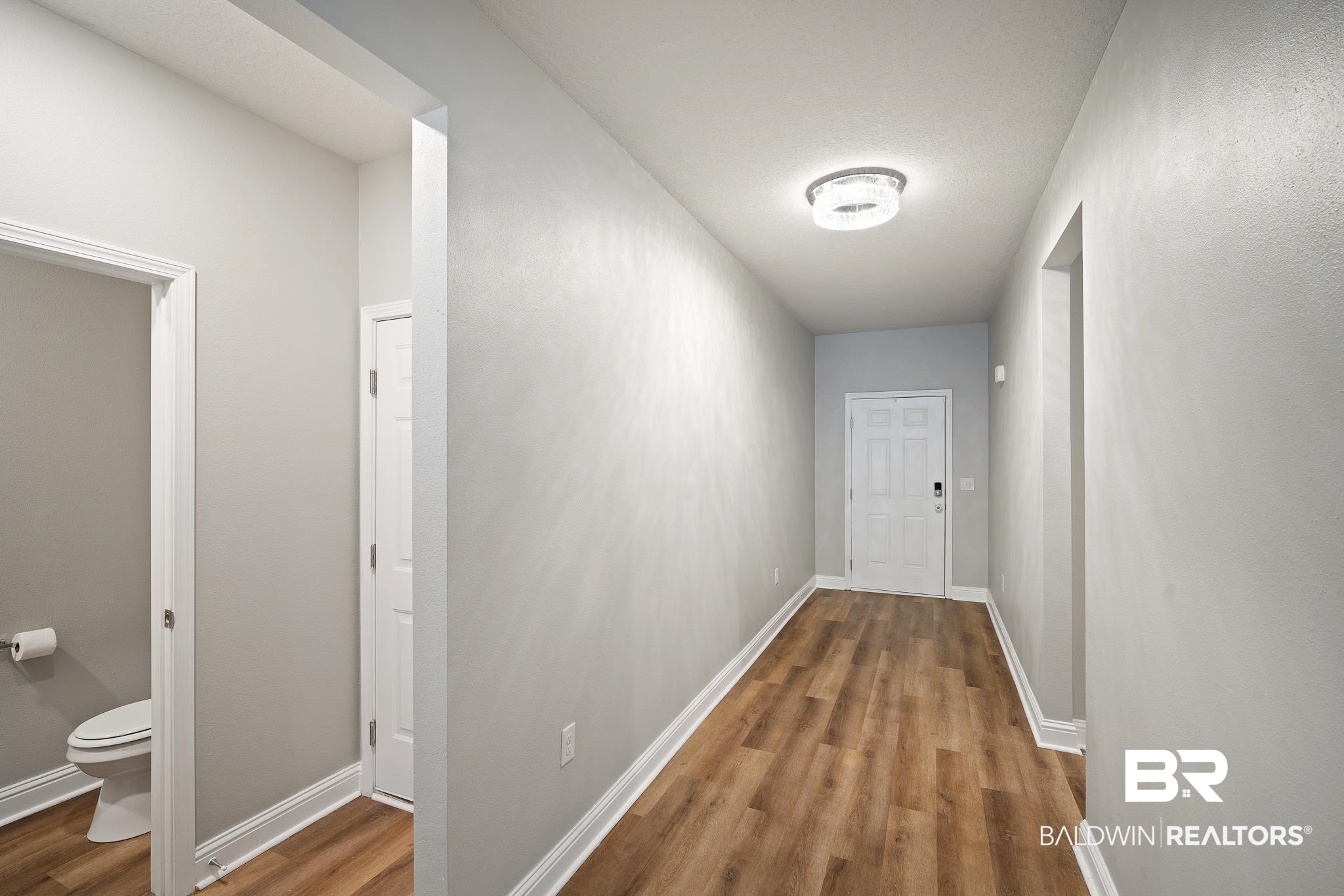 26061 Rosedown Lane Daphne, AL 36526 - Photo 20 of 44 Front Door, Garage Door Access, and Half Bath View
