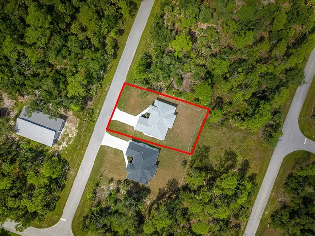 a view of a yard with swimming pool