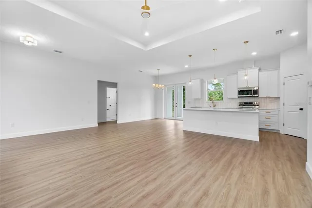 a view of kitchen with wooden floor and window