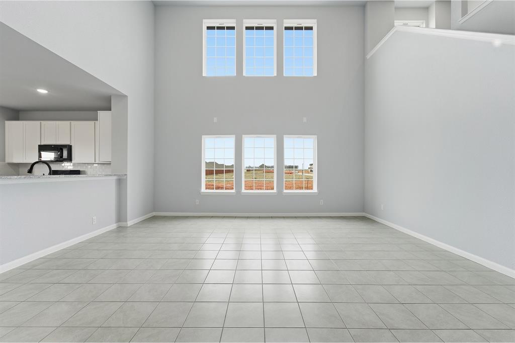 343 Caviar Road Waxahachie, TX 75165 - Photo 7 of 22 a view of a kitchen with an empty space and a window
